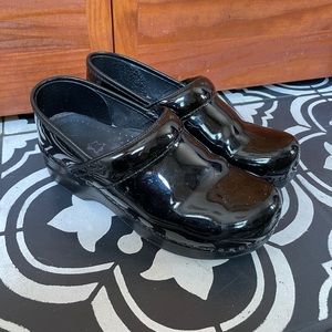Dansko patent leather clogs
